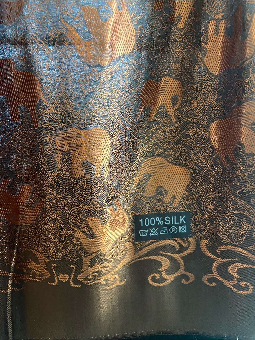 100% Silk Elephant Jacquard Scarf in Copper and black.